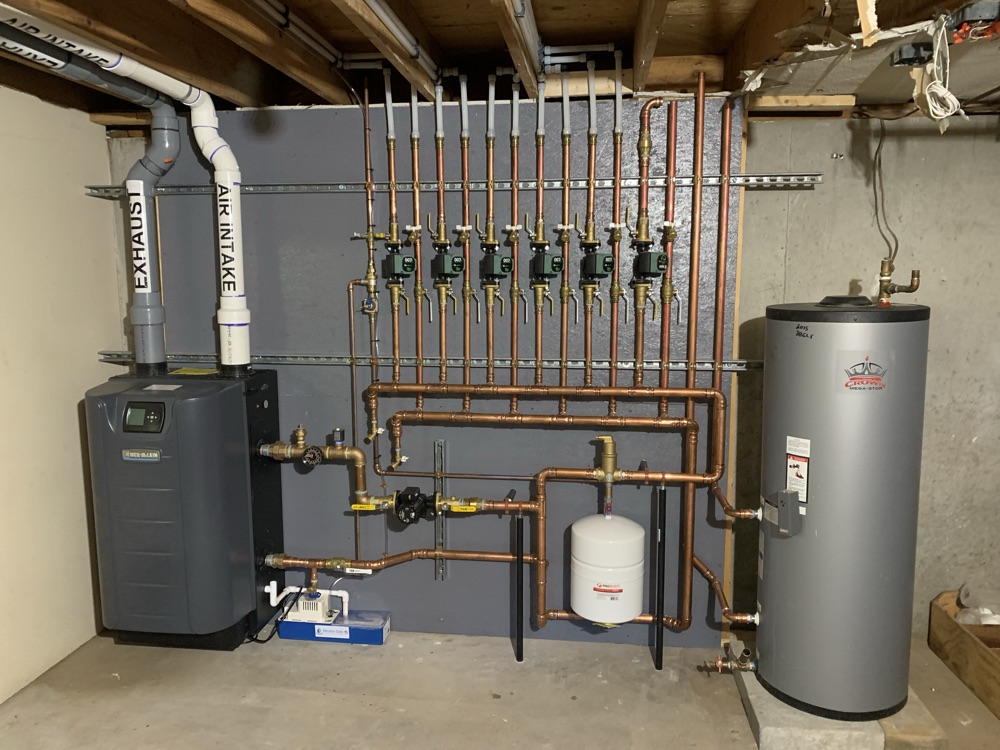 High-efficiency boiler, copper manifold, and water heater installed by TruServ